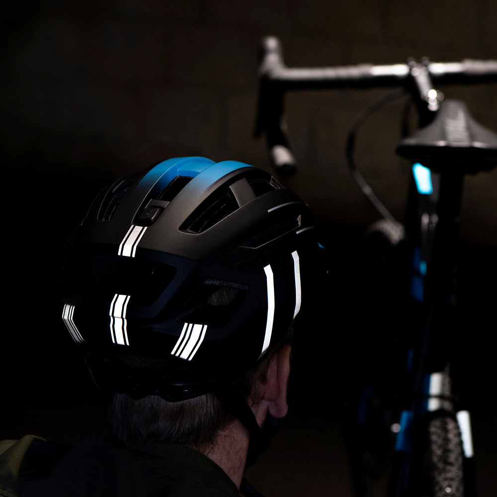 Reflective stickers on black helmet with bike in background