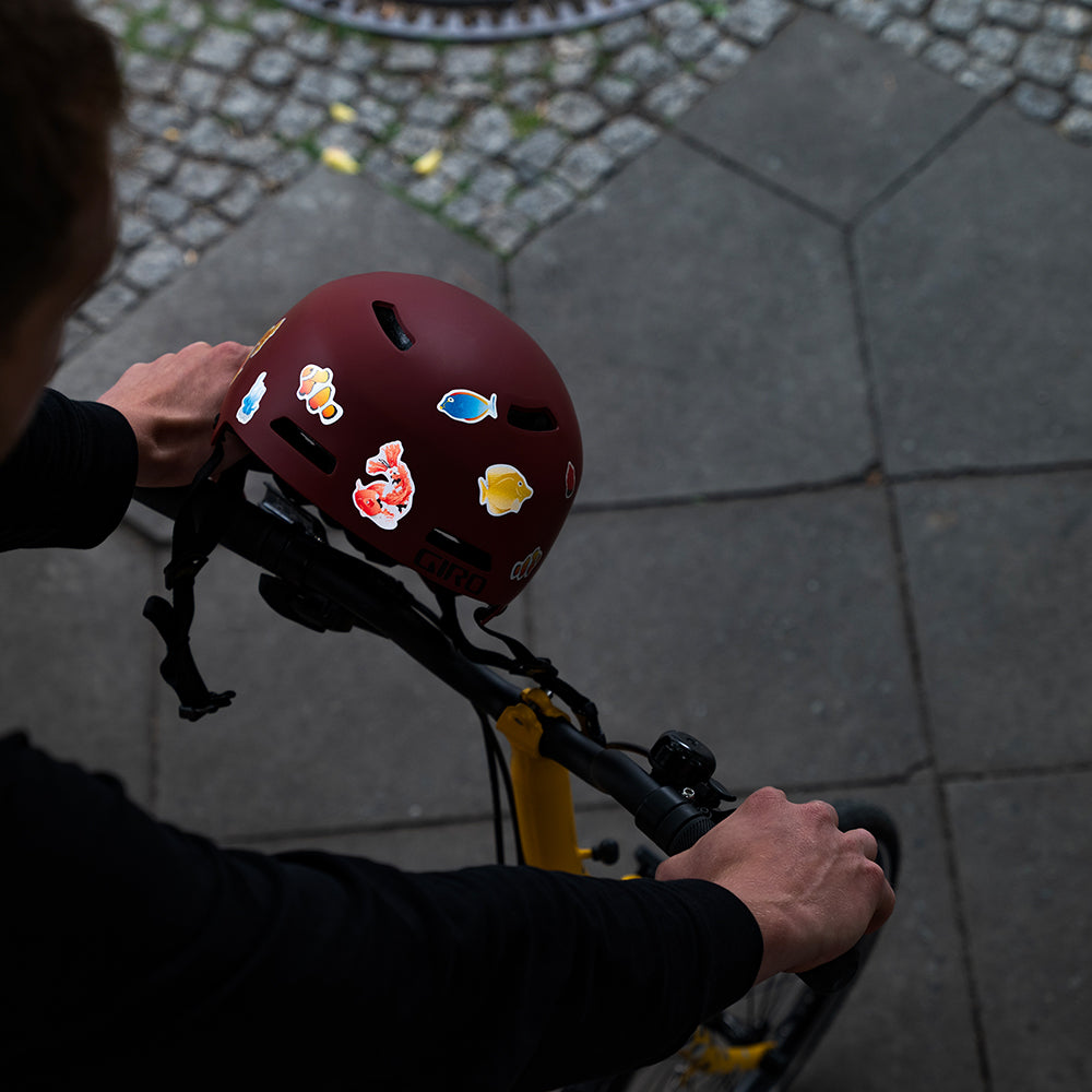 reflective sticker set with man holding his folding bicycle