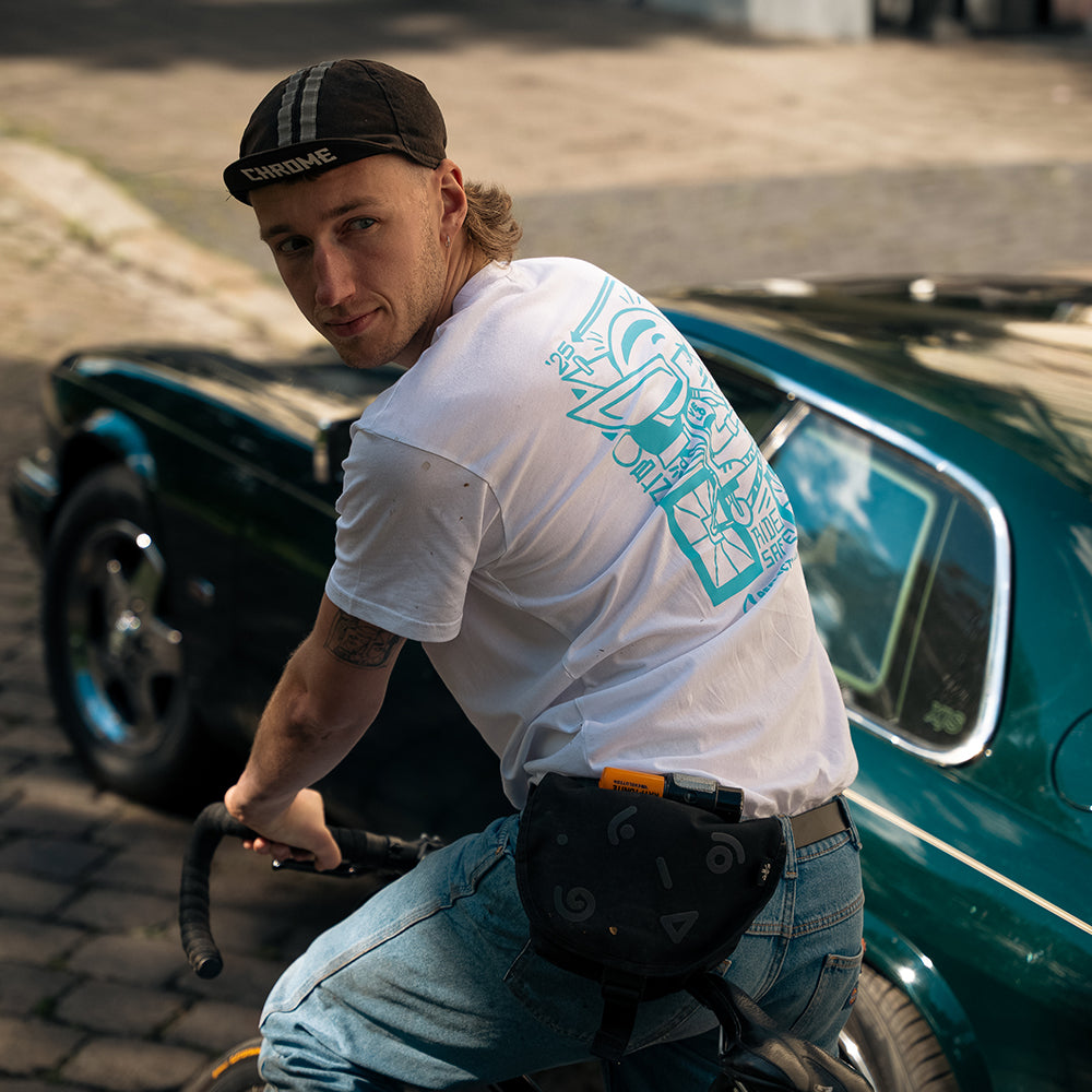 Oli wearing our Velo T-shirt and classic car in background