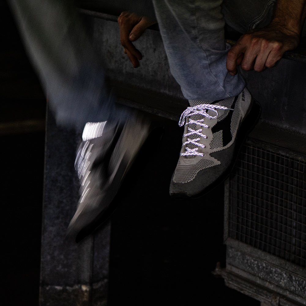 White reflective laces on shoes with motion blur