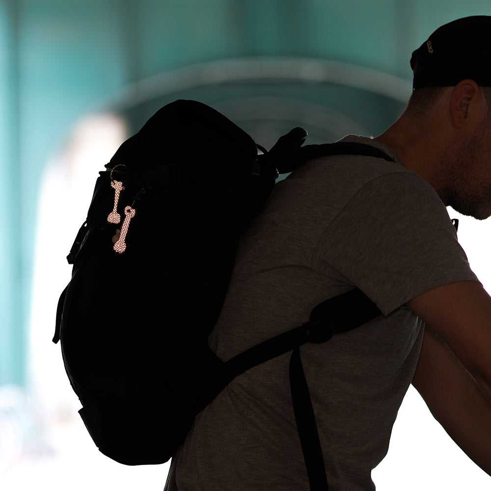 man with backpack under the bridge