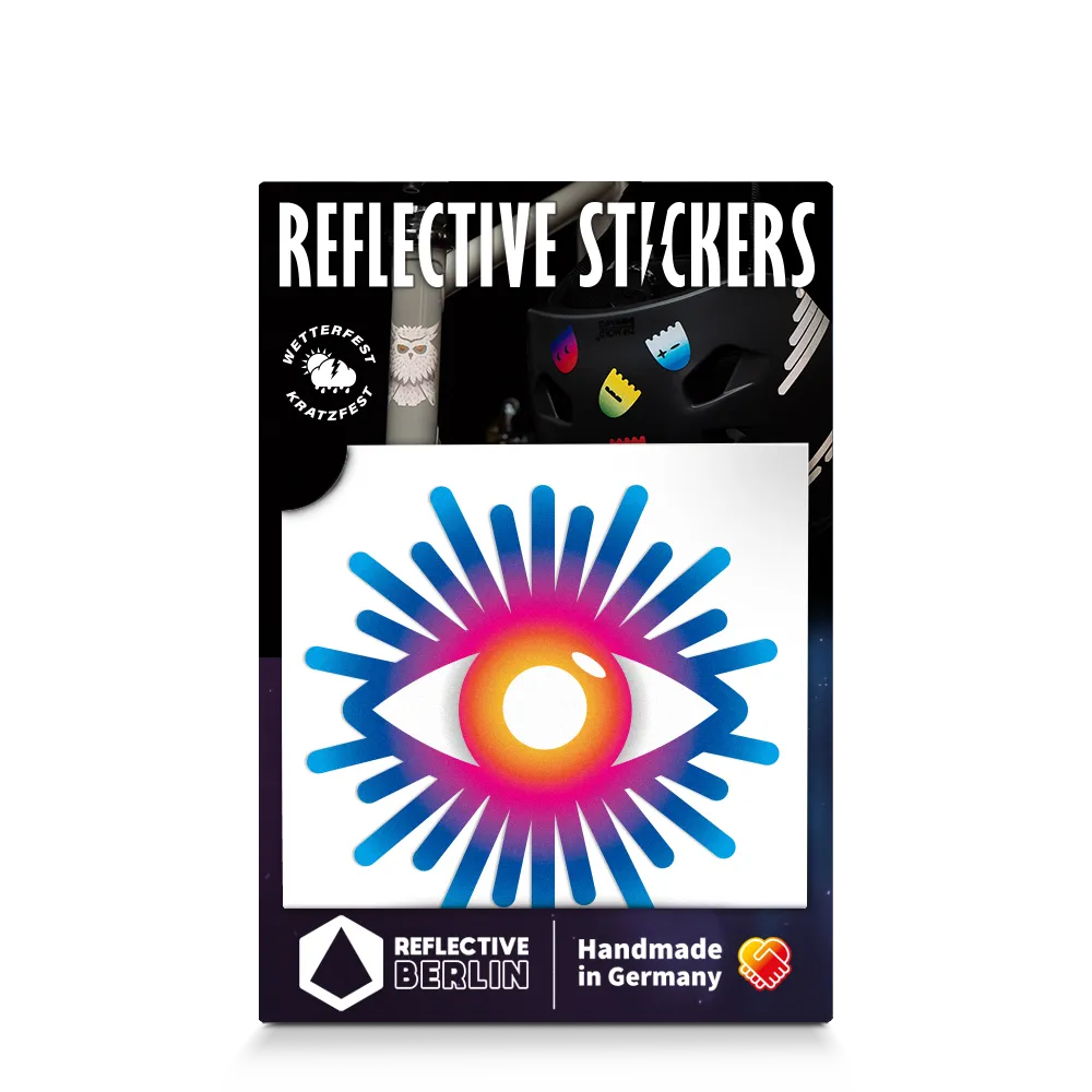 Reflektierender Aufkleber „Auge“ in Farbvariante „Regenbogen“ in Produktverpackung von REFLECTIVE Berlin.