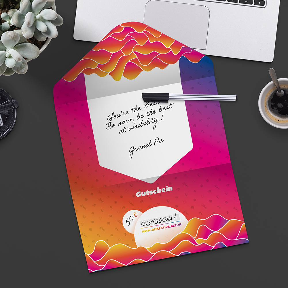 Opened giftcard, mock up on desk with computer