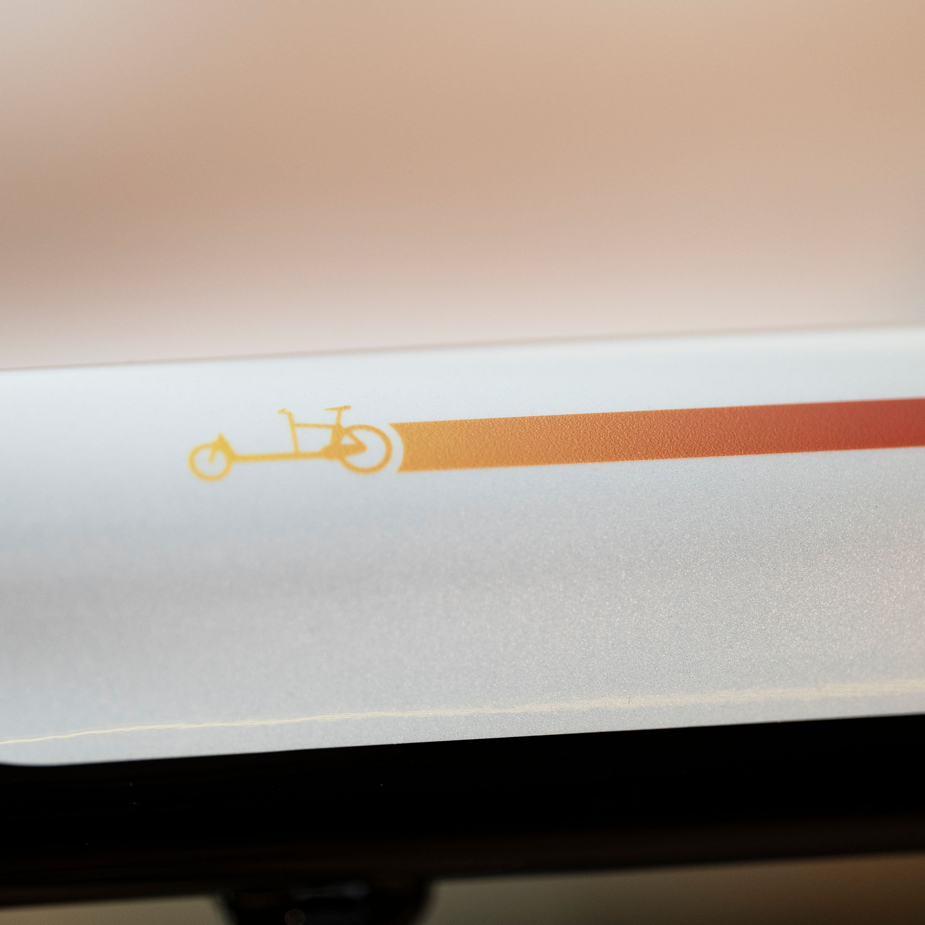 macro detail of a reflective cargo sticker, with rainbow gradient