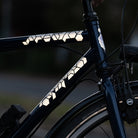 black bicycle with reflective stickers