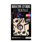 Textilsticker Music in Regenbogen-Schwarz von REFLECTIVE Berlin als verpacktes Set mit stark reflektierenden Musikmotiven für mehr Sichtbarkeit im urbanen Stil.