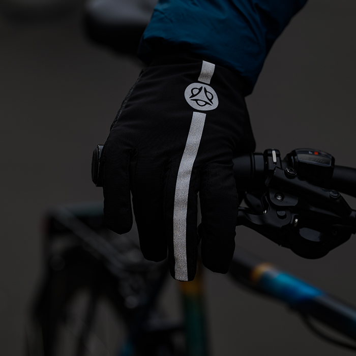 glove holding a bicycle handle bar