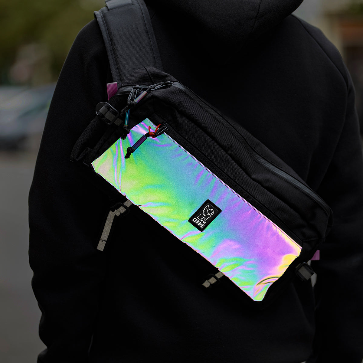 Reflective backpack with man and blurry street