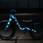 Kids bike with reflective aqua theme set and dark background
