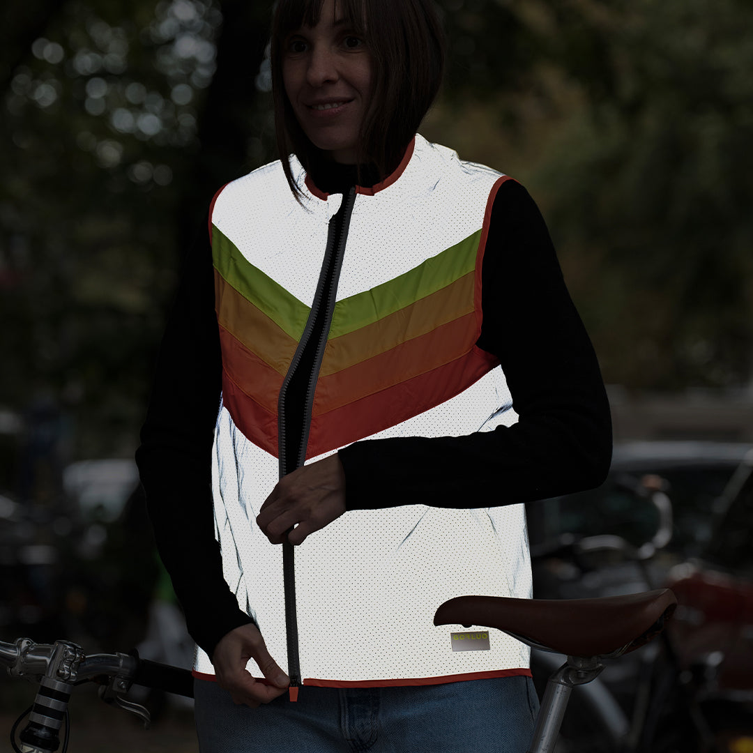 woman wearing reflective jacket in dark street