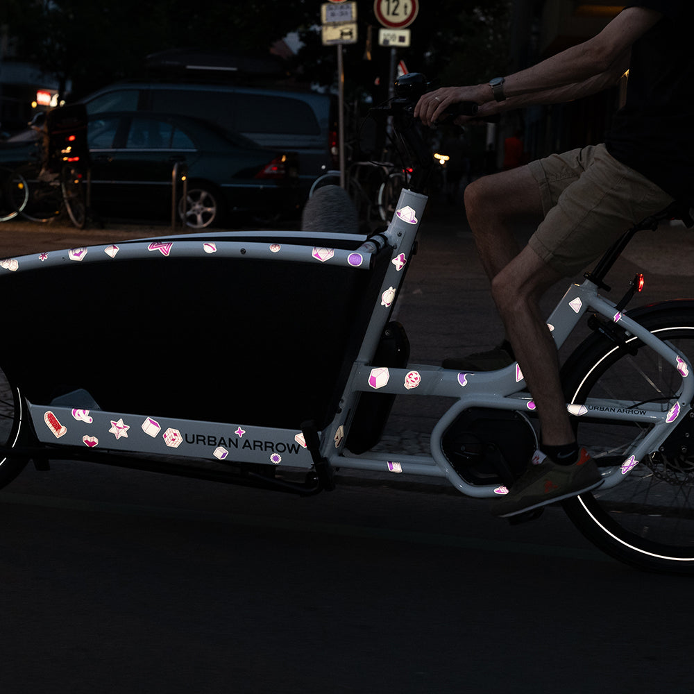 Reflective XL stickerset applied on bicycle frame riding at night in the city