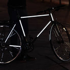 Bicycle with dark city background and reflective stickers stripes