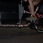 Reflective design applied on cargo bicycle frame at night with rider