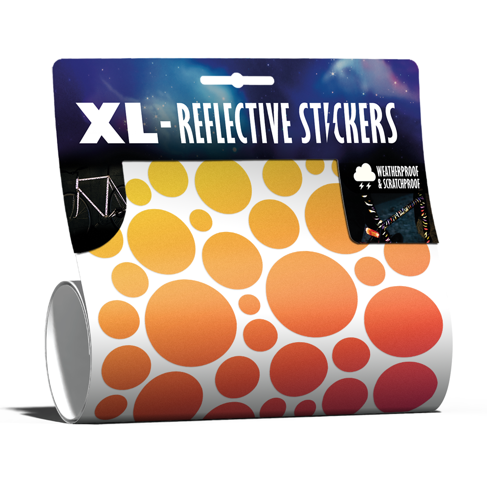 XL Bubbles in Rainbow-Farbe von REFLECTIVE Berlin als verpacktes Set mit stark reflektierenden bunten Kreisen für mehr Sichtbarkeit im urbanen Stil.