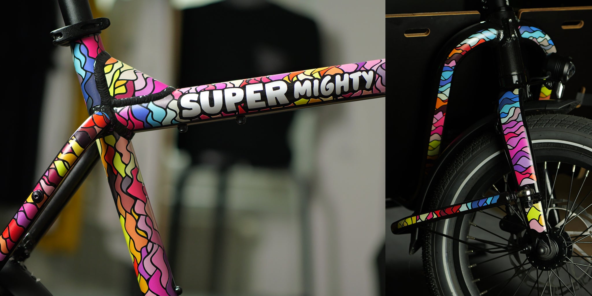 macro photo of a cargo bicycle frame with reflective design inside shop