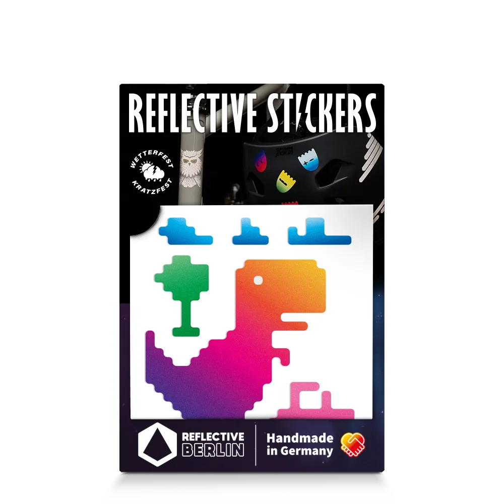 Reflektierender Aufkleber „T-Rex“ in Farbvariante „Regenbogen“ in Produktverpackung von REFLECTIVE Berlin.