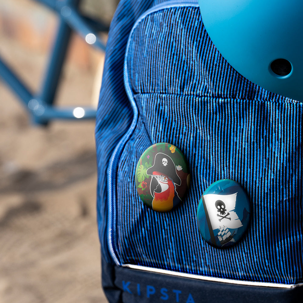 Pirate button , blue backpack and blurry background