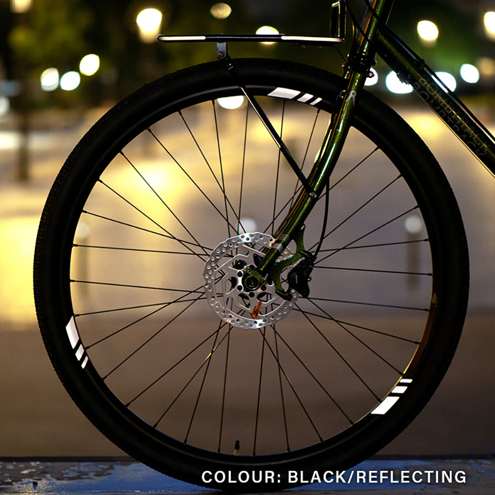 racer rim reflecting with city background