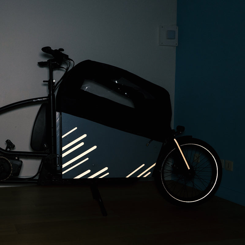 Reflective stripes applied on cargo box and front fork, in appartment