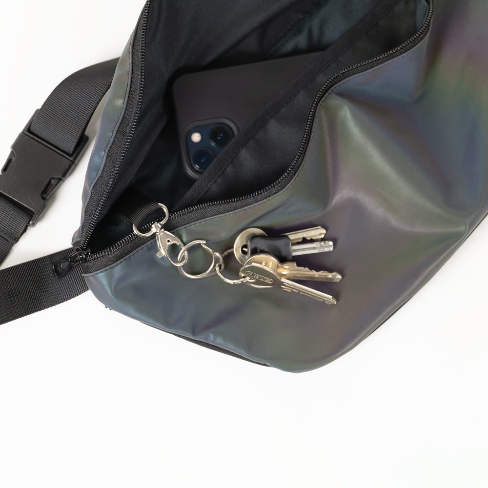 Inside of the XL rainbow reflective pouch, with key holder, second pocket and extra back pocket with zipper