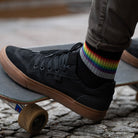 Reflective socks and skateboardon background 