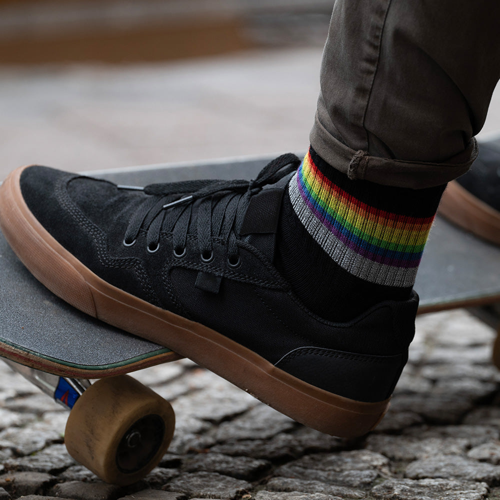 Reflective socks and skateboardon background 