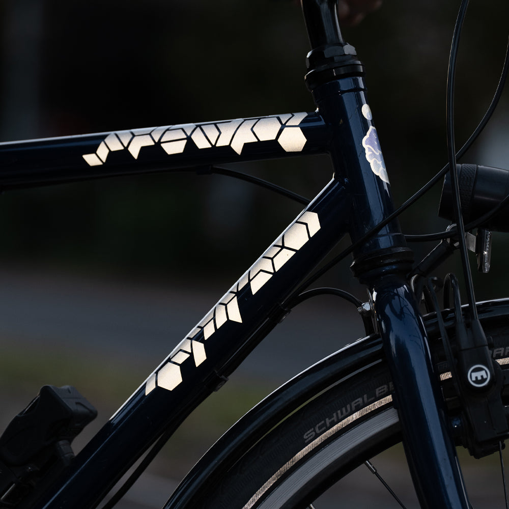 black bicycle with reflective stickers 